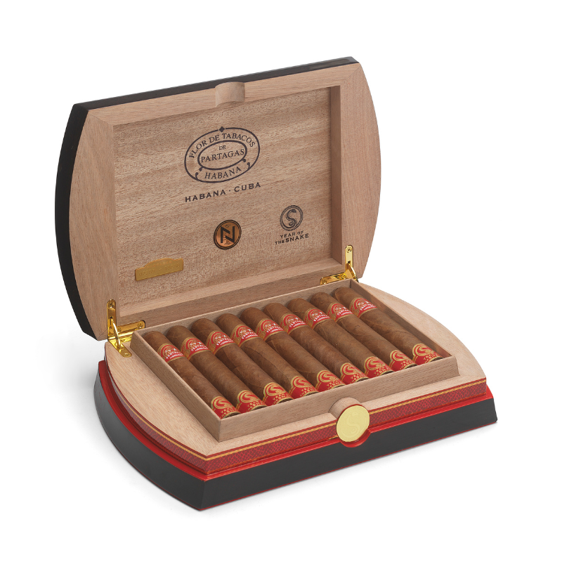 Partagas Cedros Year of the Snake Open wooden humidor with cigars on a white background
